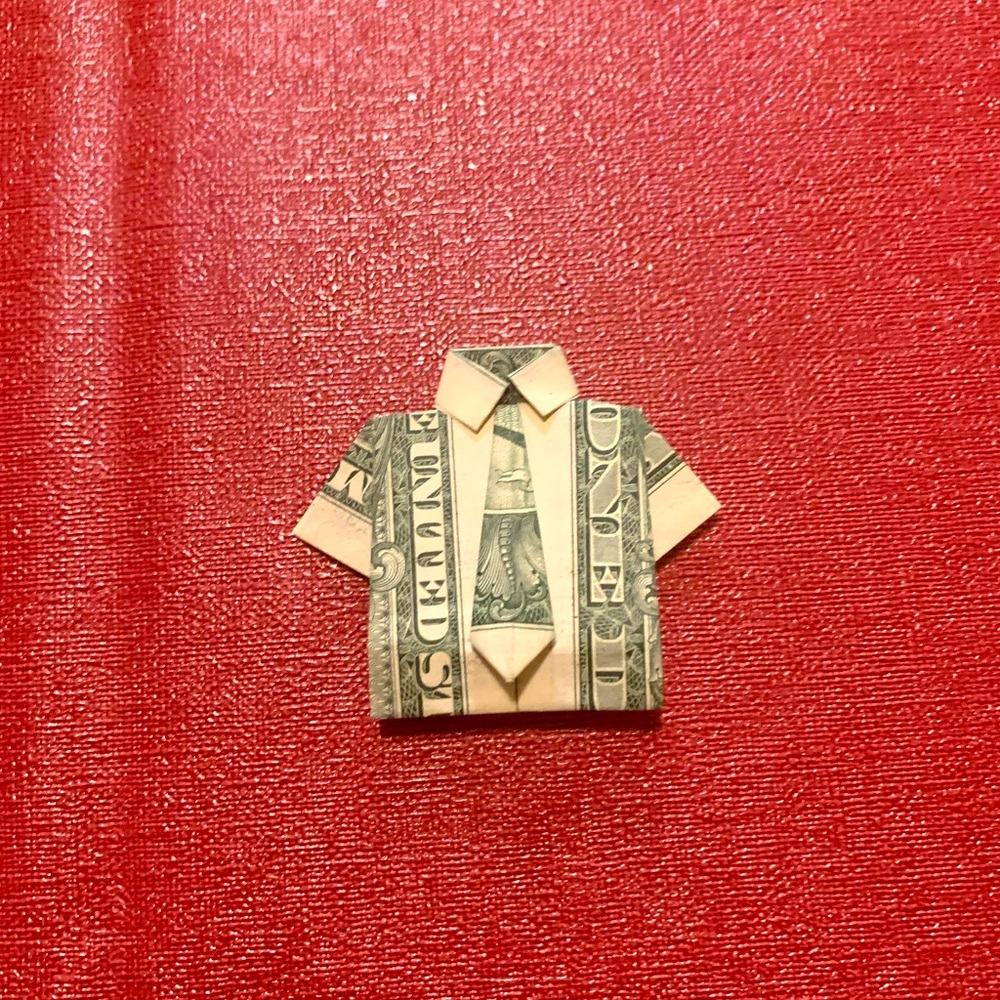 Origami shirt on dollar